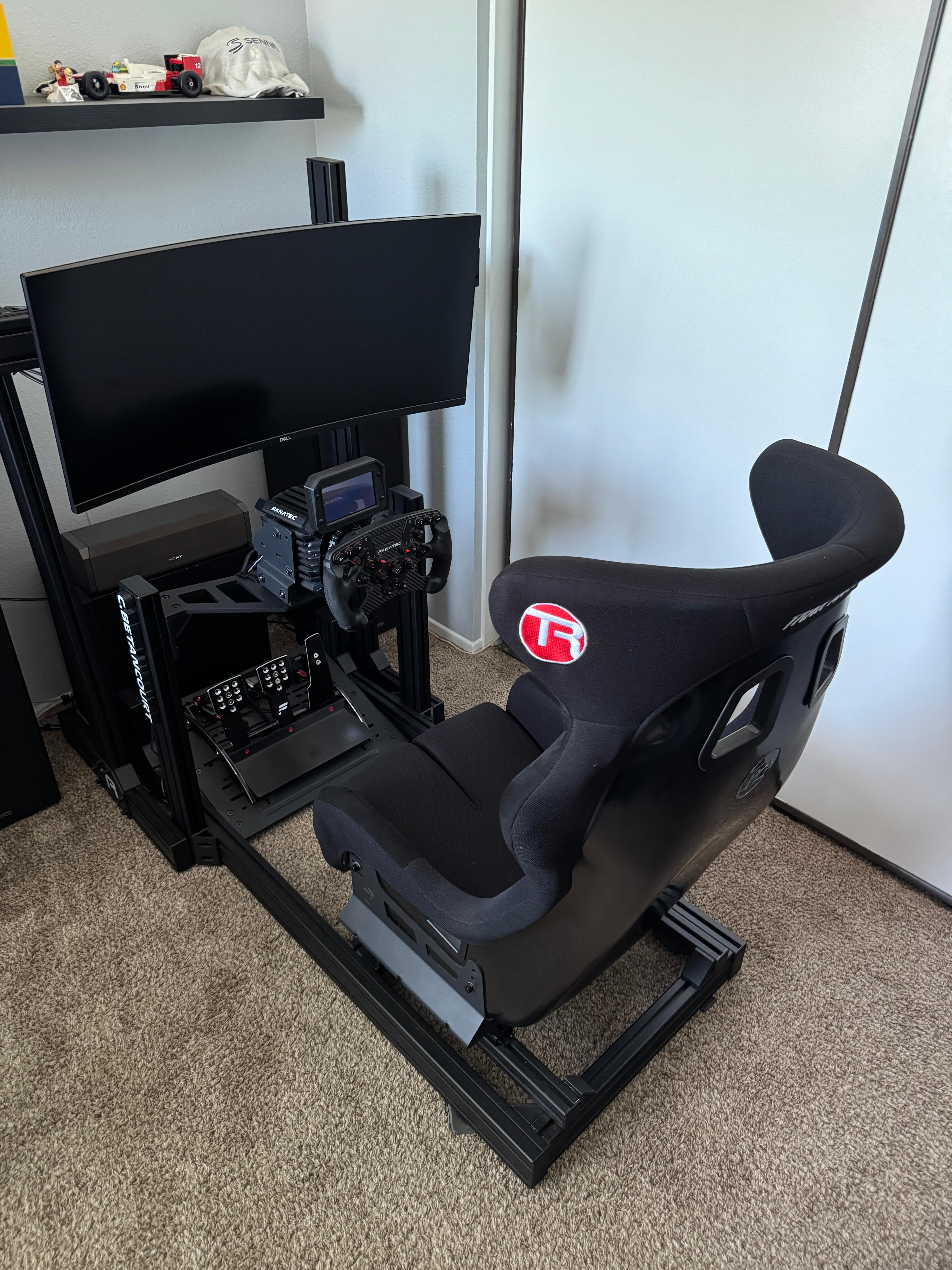 Pretty solid setup I have been running for a couple years when I can and just added a Buttkicker not too long ago! TR80 Lite paired with a GT Style Fixed Bucket Seat, 34" Monitor, Fanatec gear, and a PC.